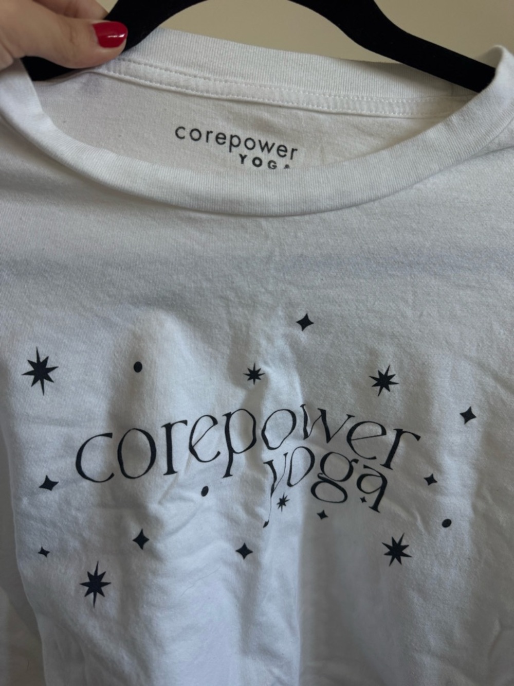 Cropped CorePower Yoga White Graphic Tee with Black Star Print